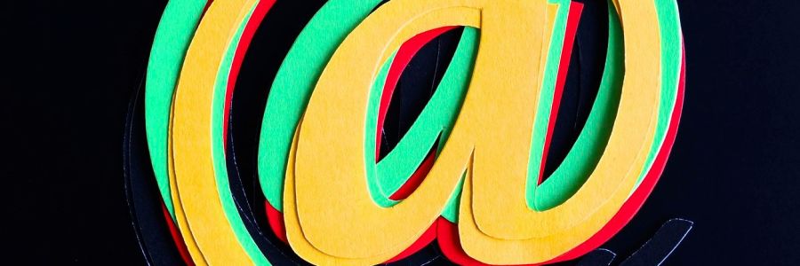 Colorful @ symbol on black background