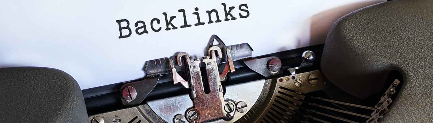 The word "Backlinks" typed on white paper